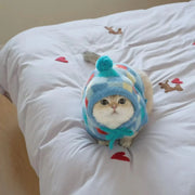 Suéter de gato con capucha y pompones con estampado de rombos
